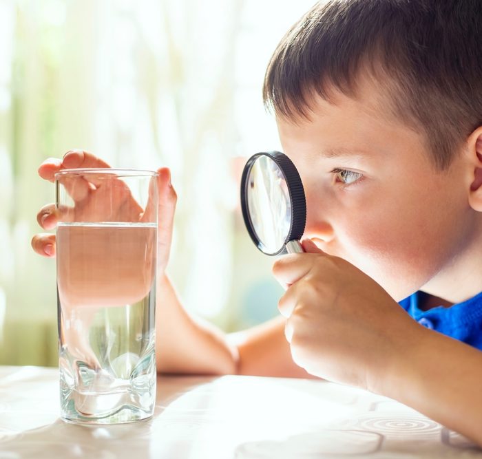 The,Child,Boy,Looking,At,Water,In,A,Glass,Through